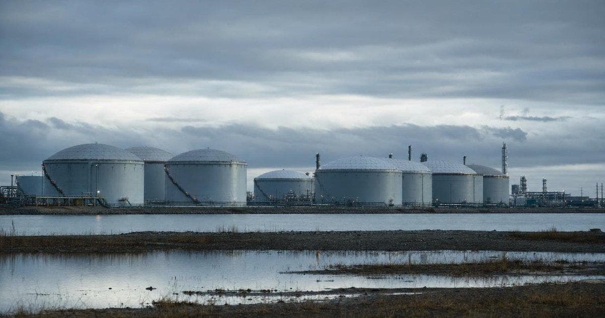 Crude oil storage tanks at an industrial terminal as rising oil above $100 pressures Dow futures