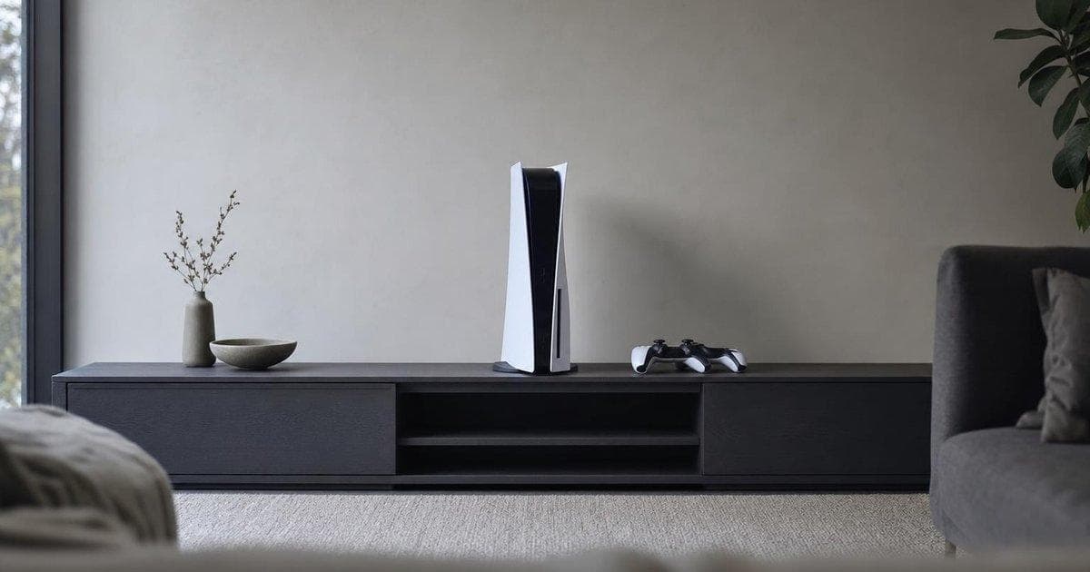 Home video game console on TV stand illustrating global price hike and slower outlook for console maker