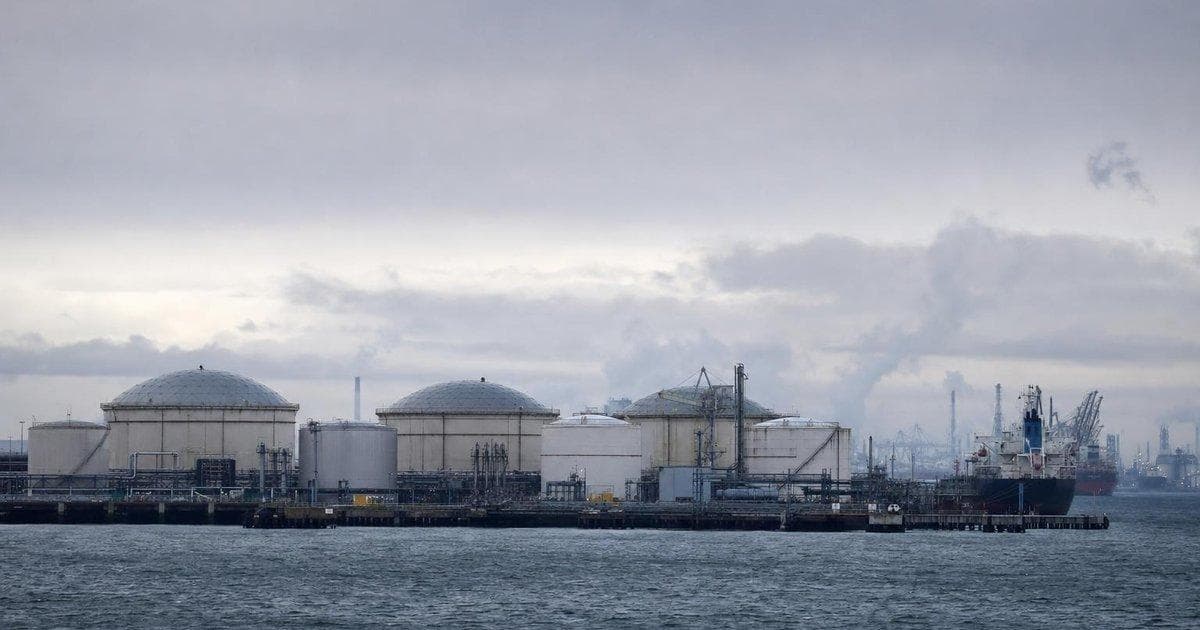 Fuel storage tanks at an energy terminal as rising gas prices and tariffs pressure U.S. stock markets