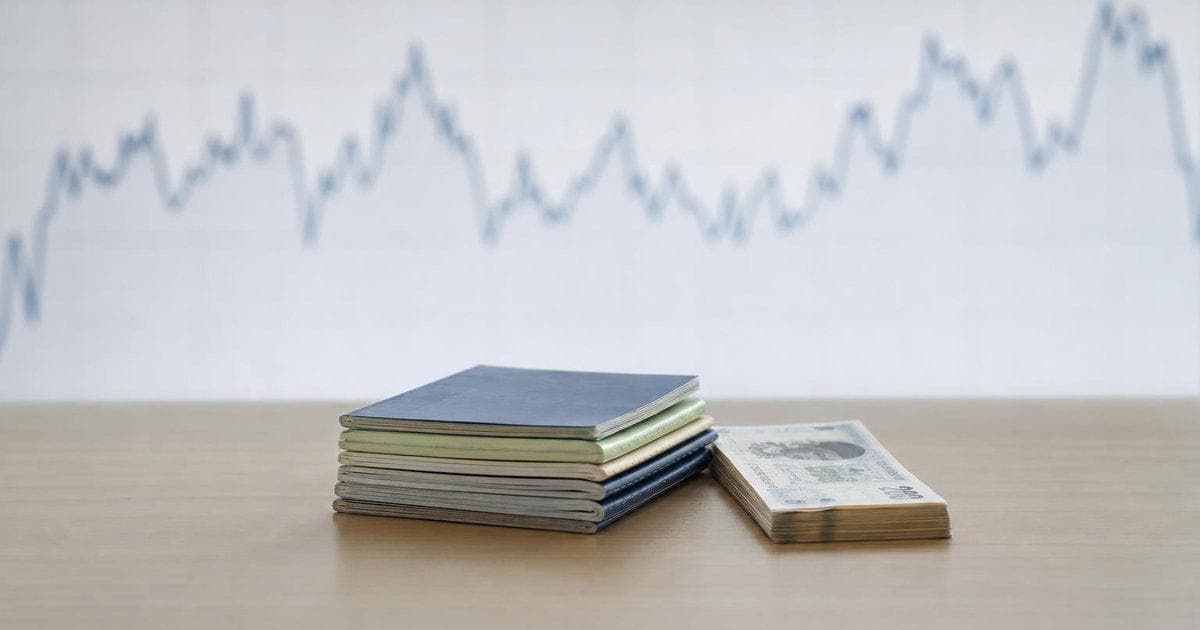 Bank passbooks and cash on a desk illustrating high-yield money market account rates on May 9, 2026