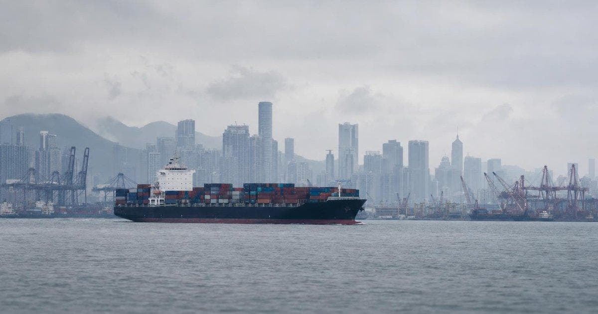 Container ship at busy Asian port reflecting concerns over China recovery data and markets