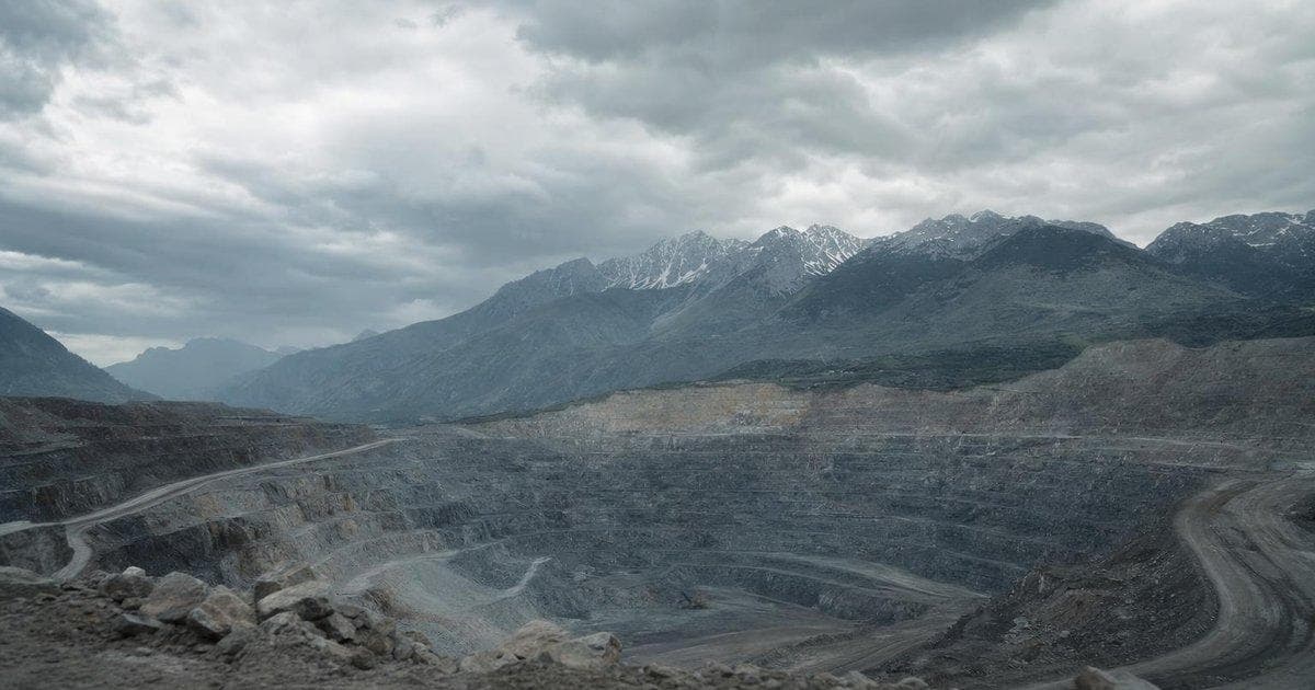 Open-pit mine with heavy equipment illustrating EXIM $2.9bn loan for critical metals project