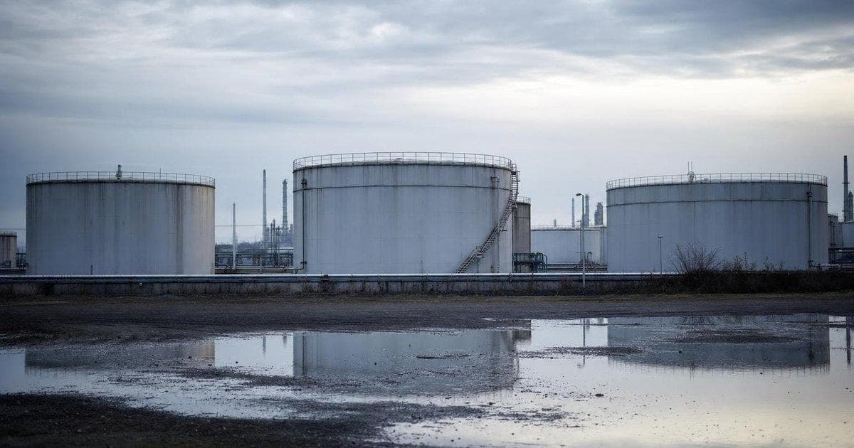 Crude oil storage tanks at an industrial terminal amid tightening supply and rising prices for global oil markets