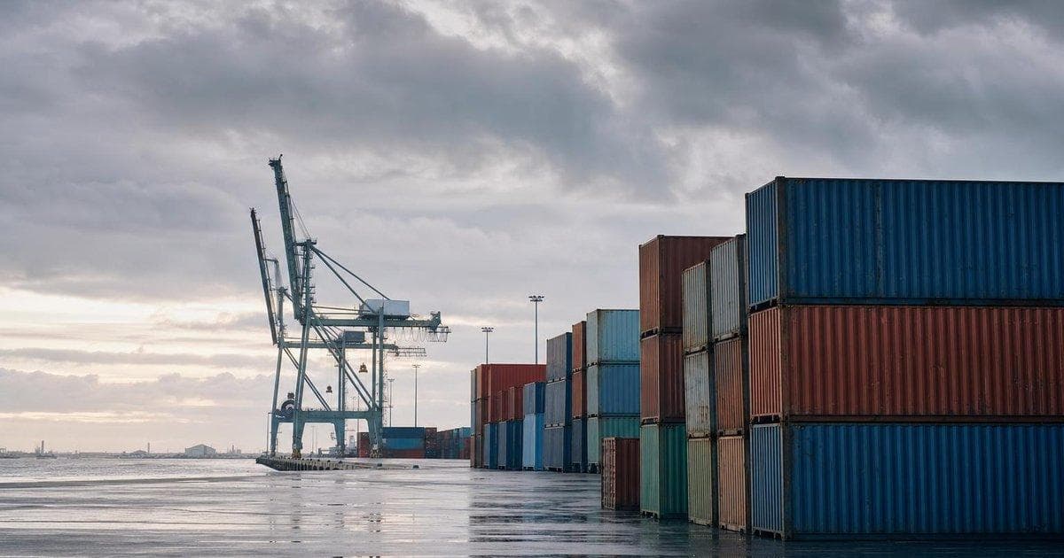 Bulk export port with stacked shipping containers as Indonesia centralises key commodity exports