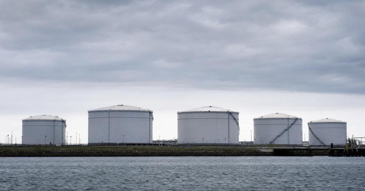 Crude oil storage tanks at a coastal terminal as rate hikes and Iran talks sway global oil prices