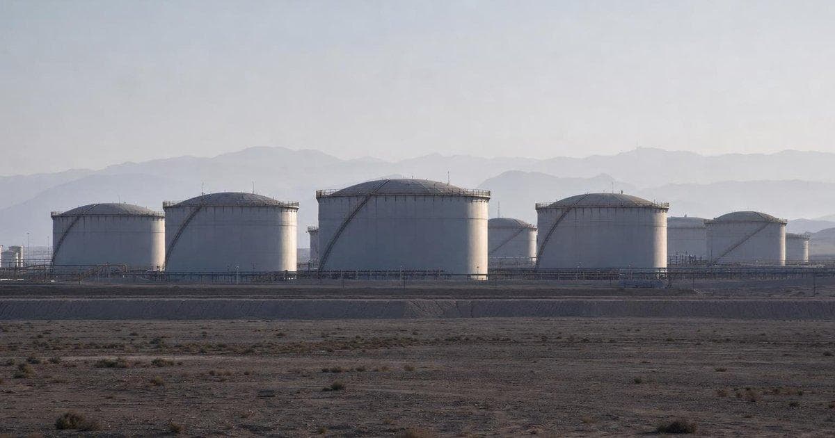 Oil storage tanks at a desert refinery as crude prices jump on Middle East strike headlines