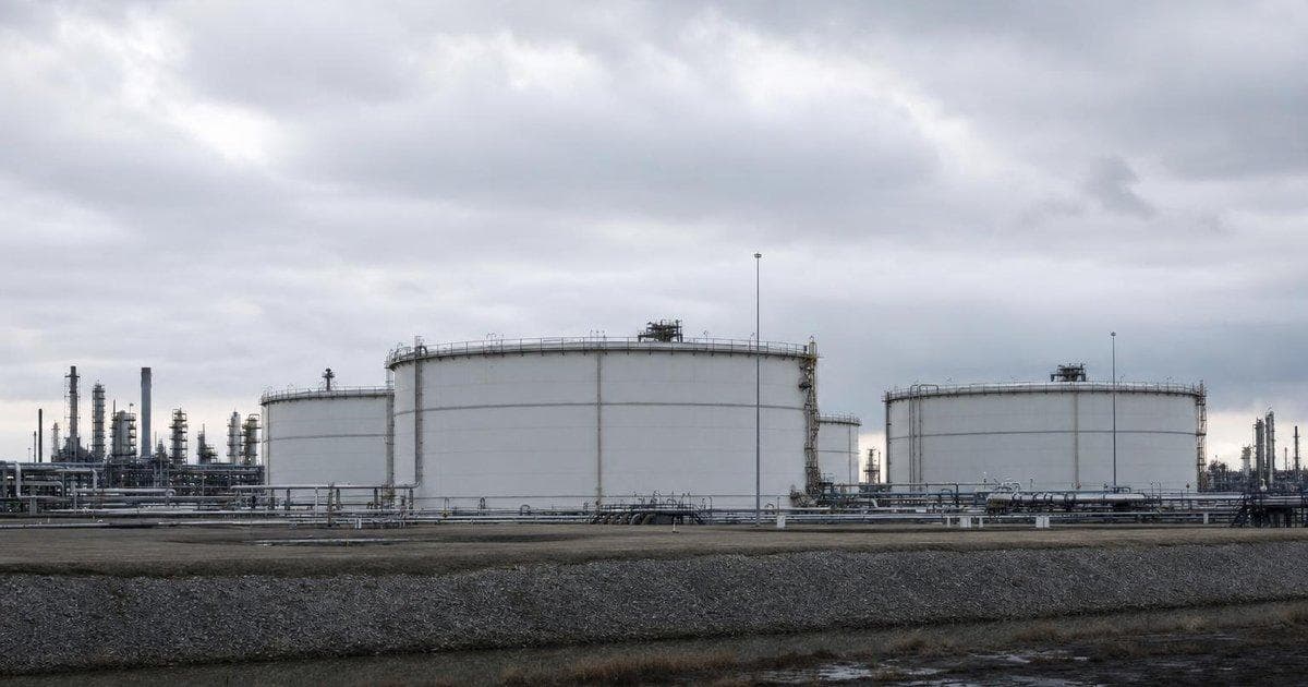 Crude oil storage tanks at an industrial terminal as traders watch volatile oil prices near $90