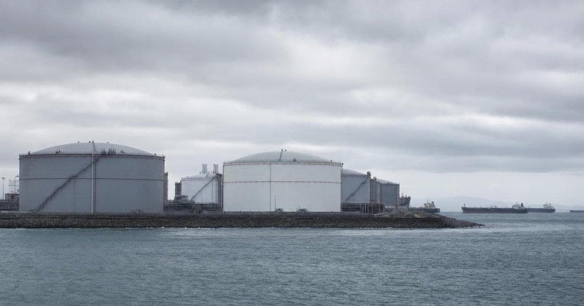 Crude oil storage tanks at a coastal terminal as Iran-related talks weigh on oil prices
