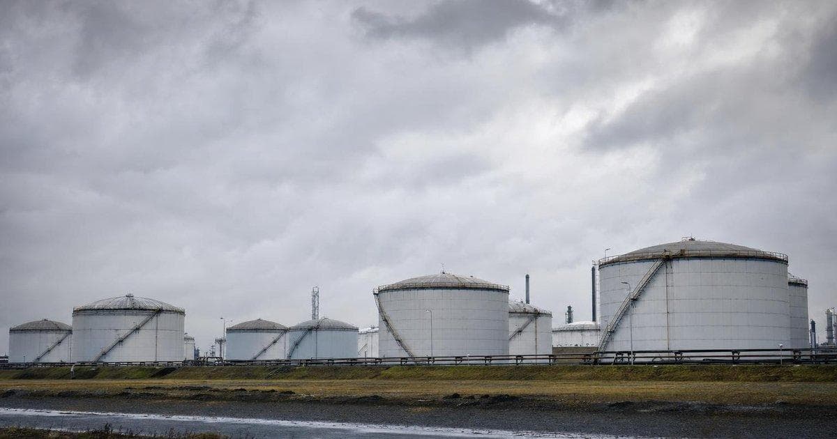 Crude oil storage tanks at an industrial terminal as demand worries and Iran talks pressure energy markets