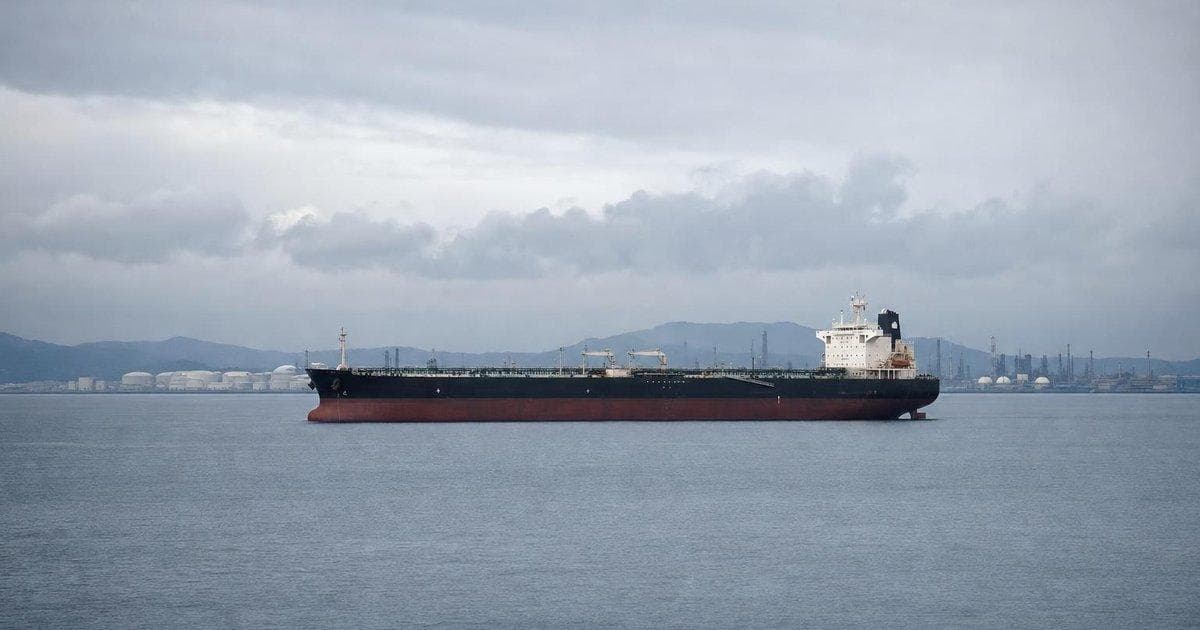 Oil tanker near coastal storage tanks illustrating India-US energy security and fuel trade talks