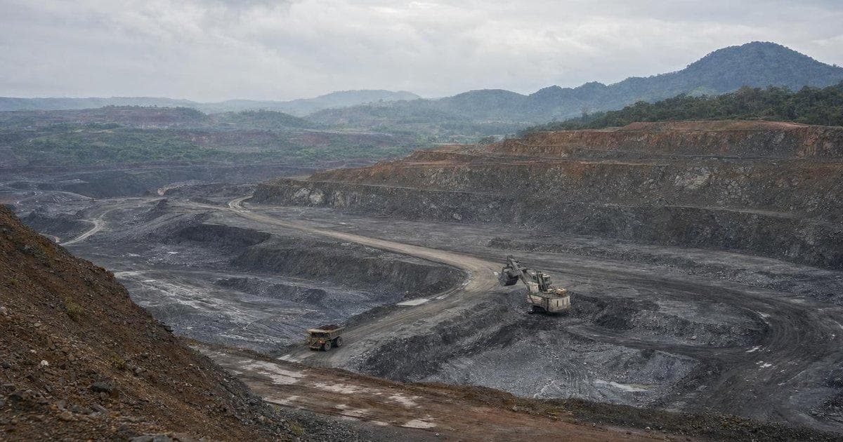 Tropical open-pit nickel mine illustrating a resource firm’s exit from a Caribbean nickel venture