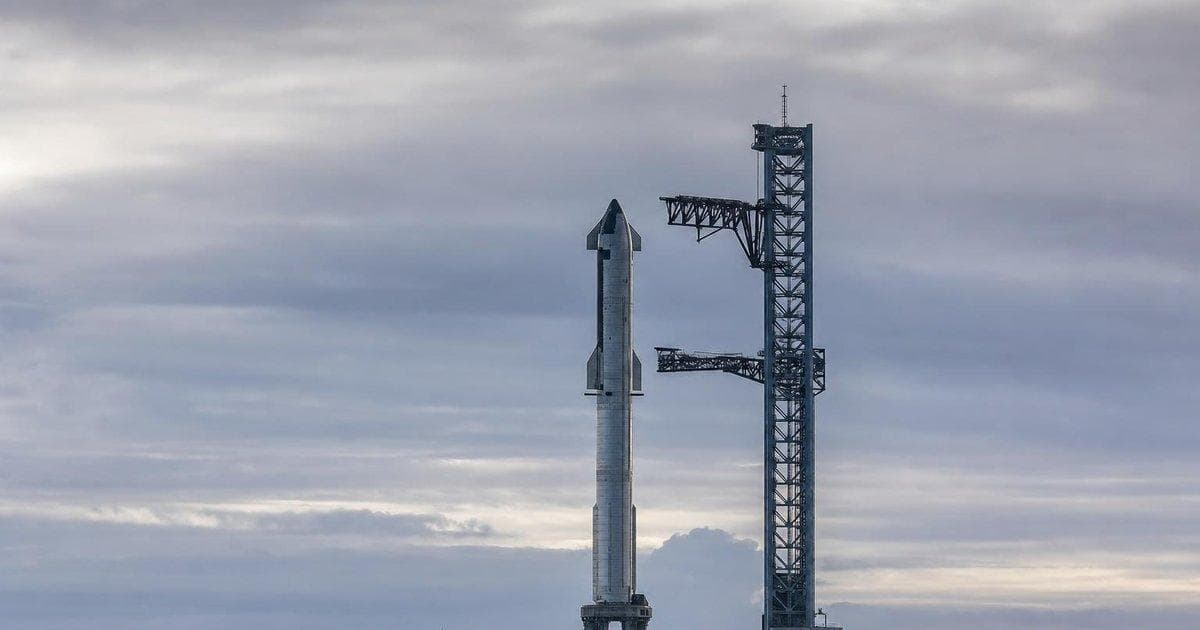 Grounded stainless-steel rocket on launch pad after scrubbed Starship Flight 12 attempt