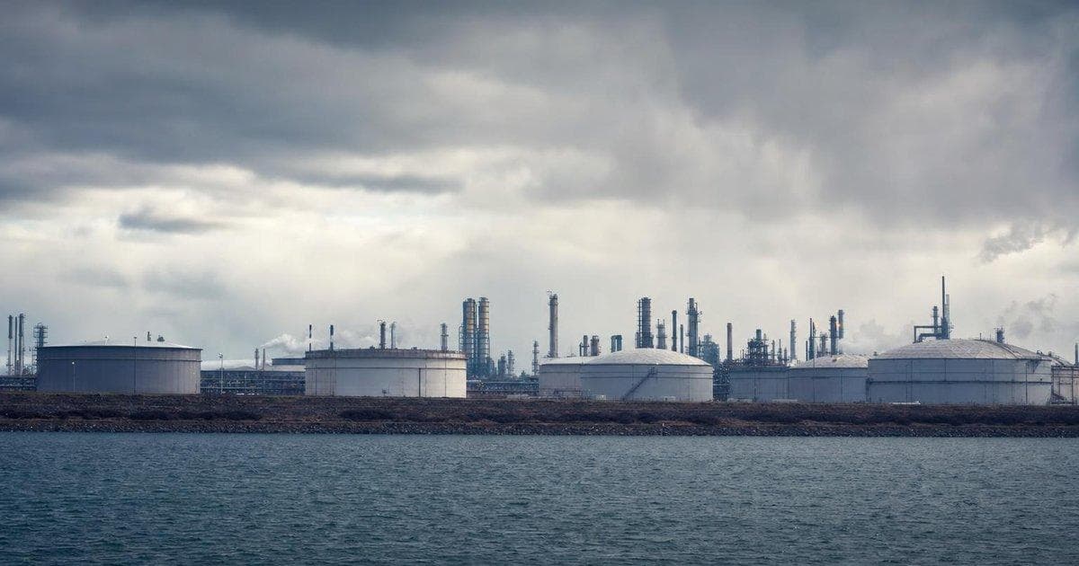 Crude oil storage tanks at a coastal terminal as Middle East tensions ease, impacting global oil prices