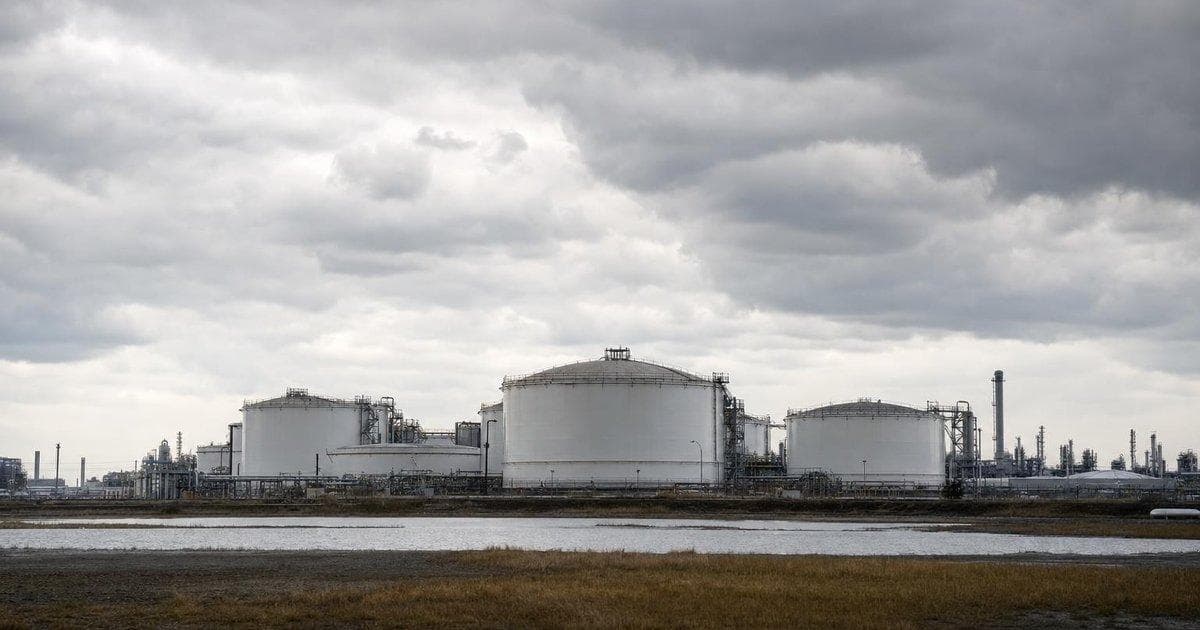 Oil storage tanks at an energy facility reflecting tensions over Iran nuclear accord talks