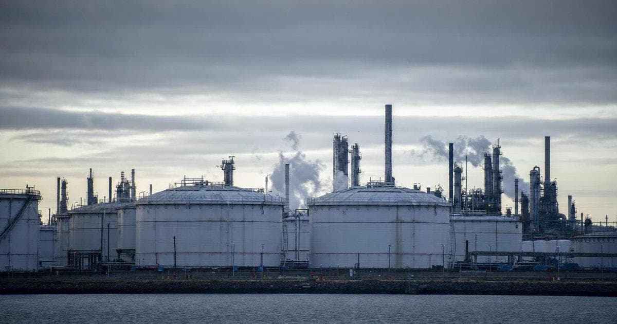 Oil refinery storage tanks at a major facility, highlighting crude supply risk after drone strikes