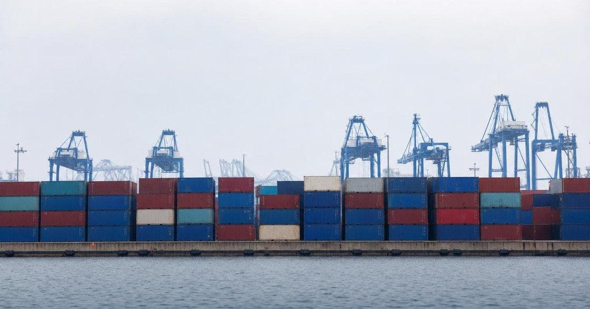 Stacks of shipping containers at a port, illustrating new USTR forced-labor tariffs on global imports